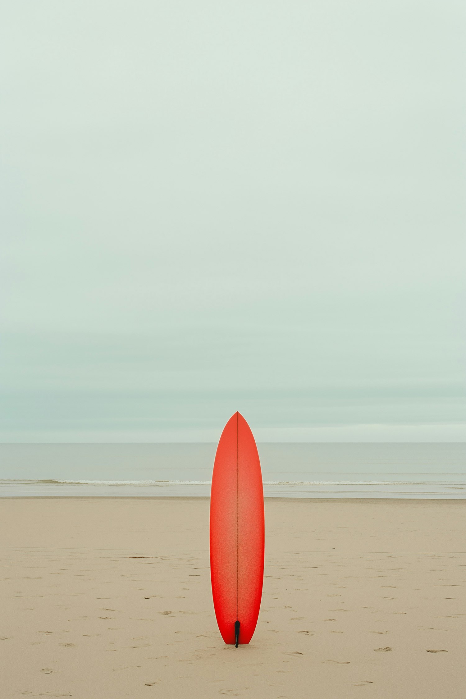 Serene Beach and Red Surfboard