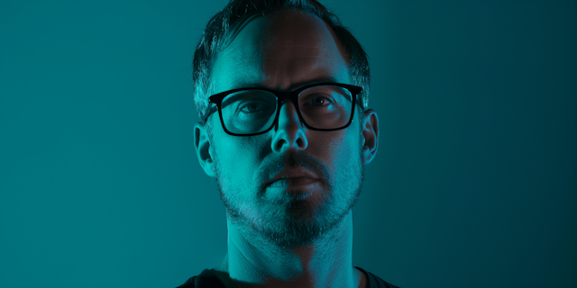 Moody Portrait of a Man in Teal Lighting