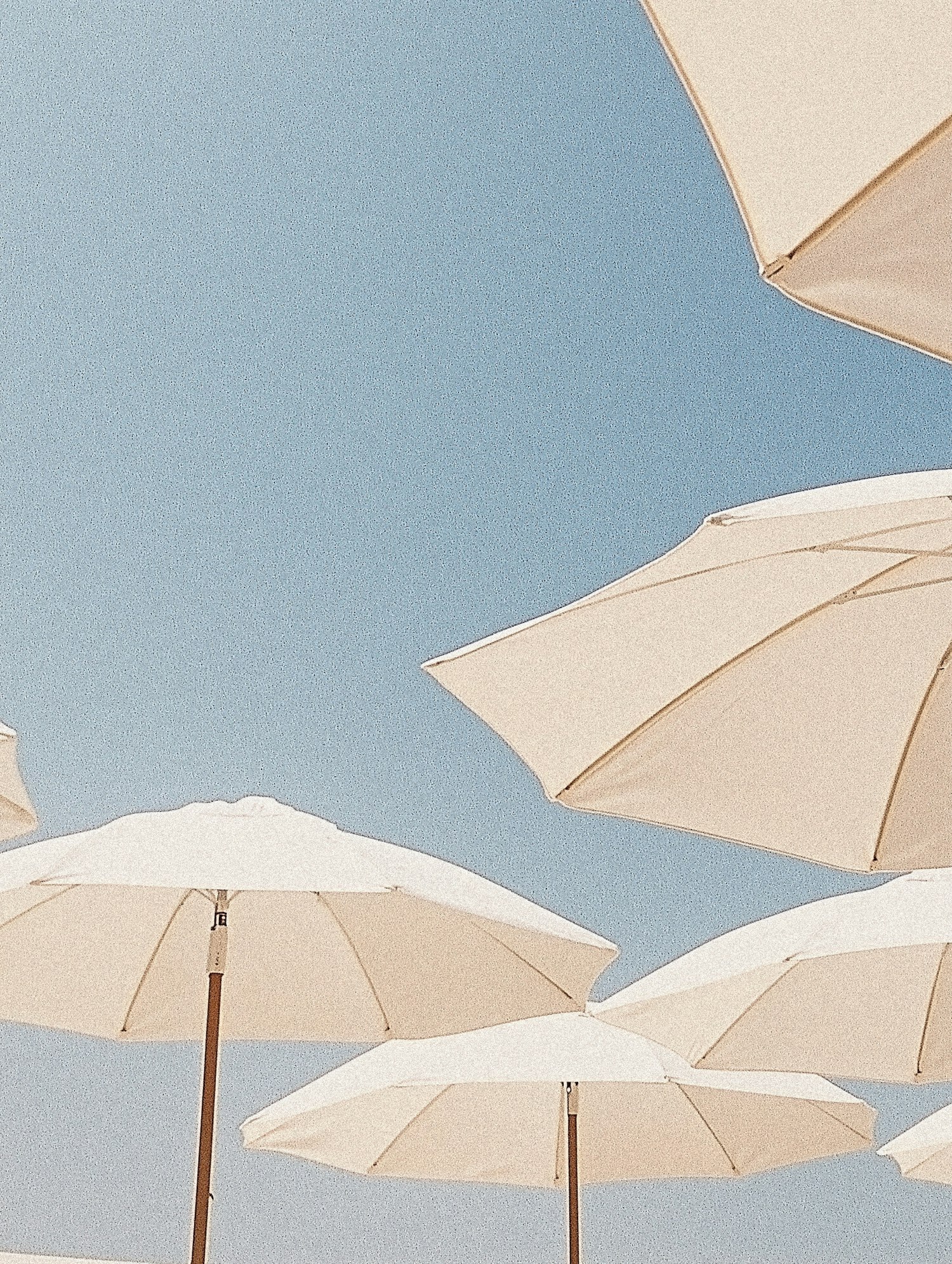 Beach Umbrellas Under Blue Sky