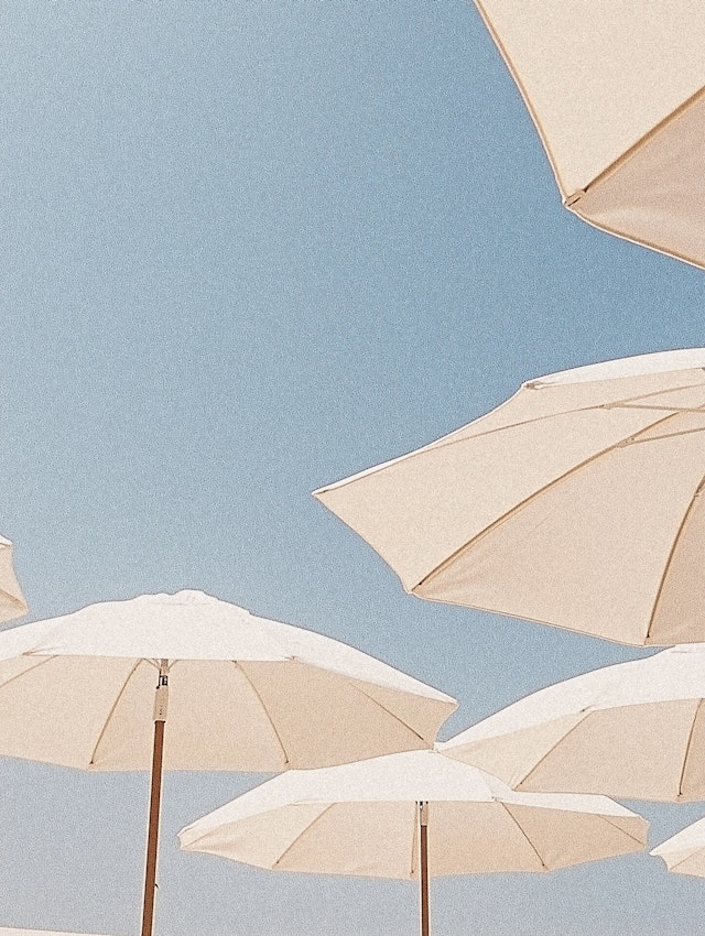 Beach Umbrellas Under Blue Sky