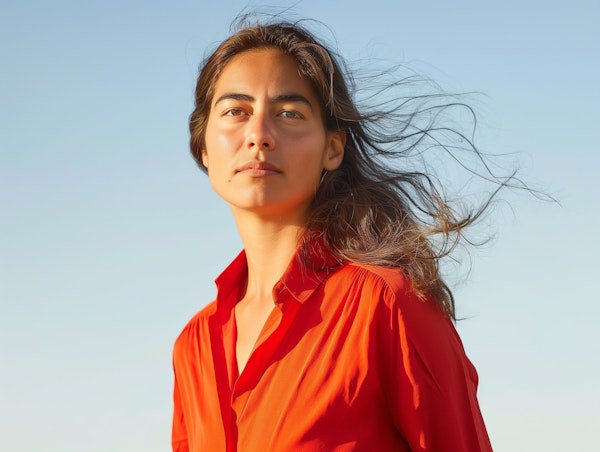 Serene Portrait of Woman in Orange Shirt