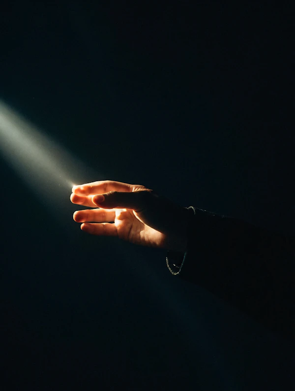 Illuminated Hand in Dark