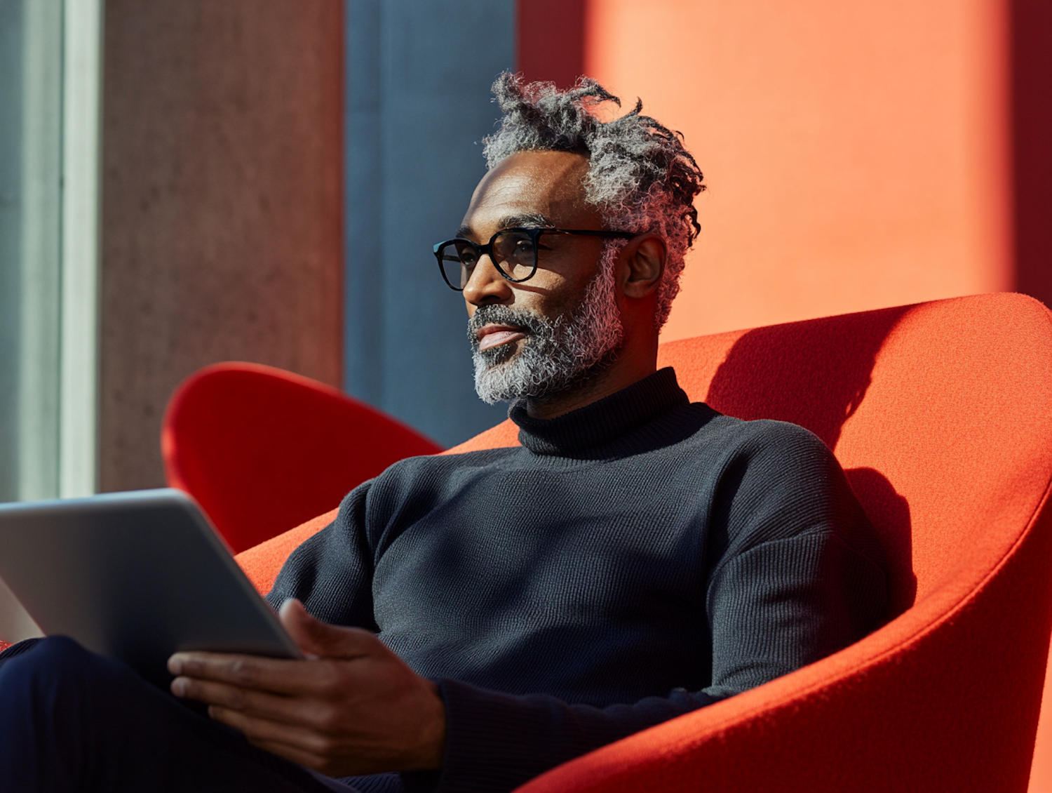 Contemplative Man in Red Chair