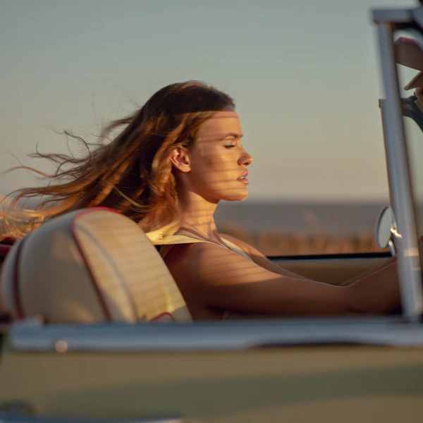 Woman Driving at Sunset