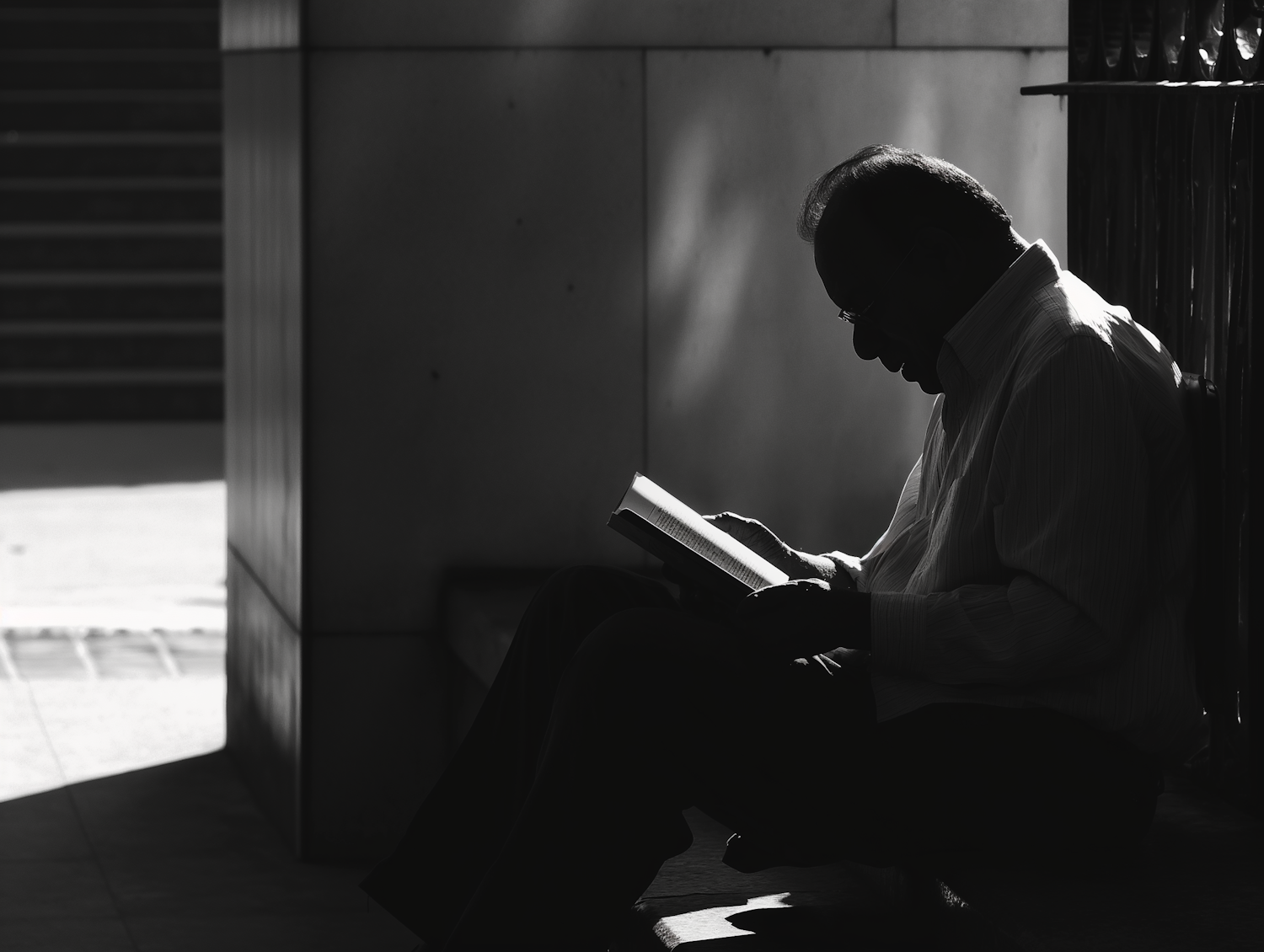 Man Reading Book in Tranquil Setting