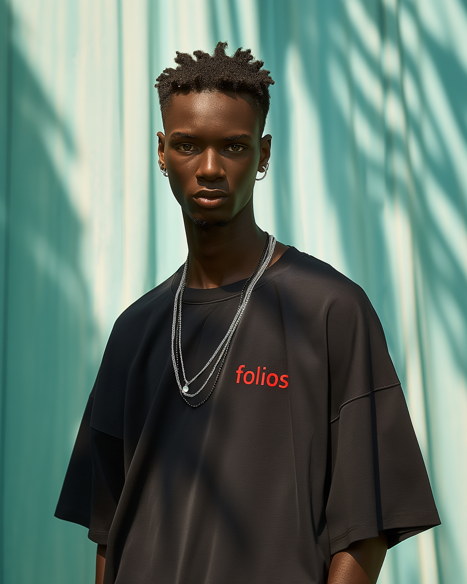 Serious Young Man with Silver Necklaces