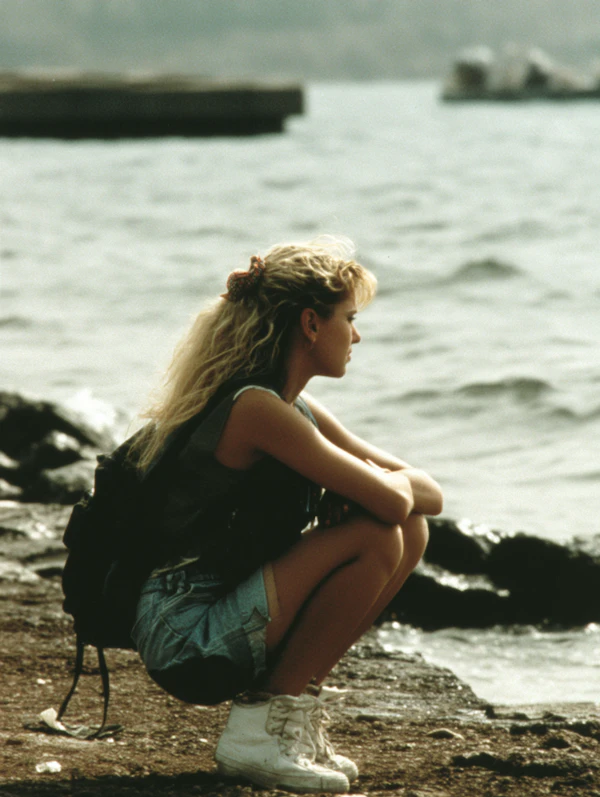 Woman by Rocky Shoreline