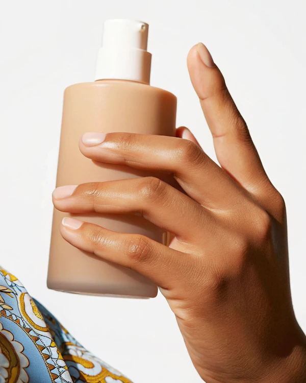 Hand Holding Pump Bottle