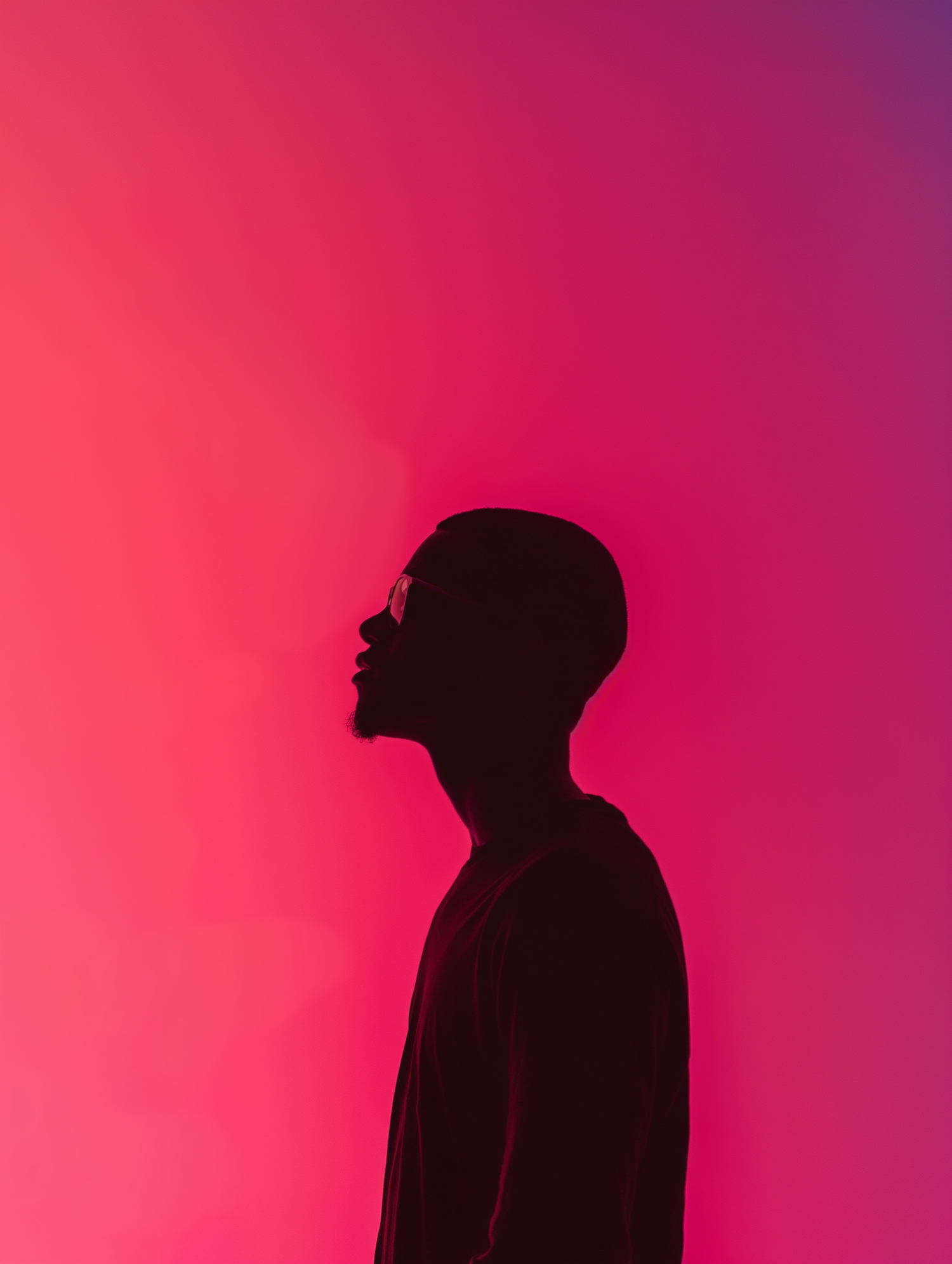 Contemplative Silhouette in Pink Gradient