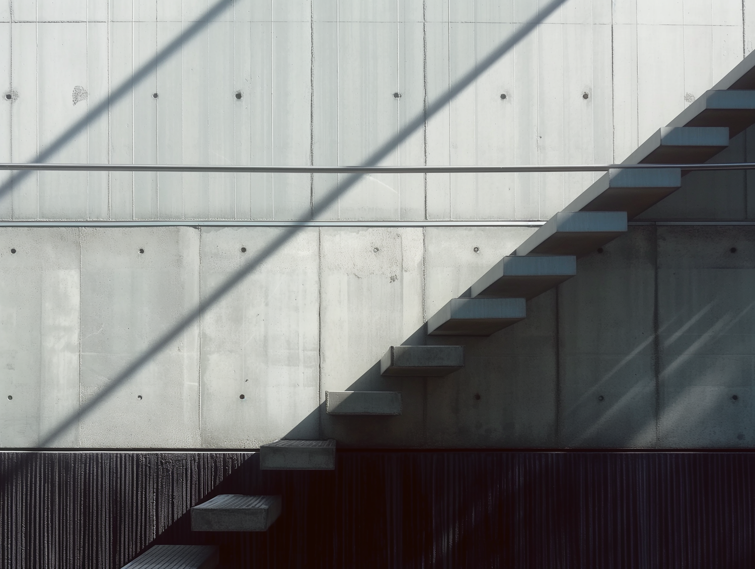 Geometric Staircase and Concrete Wall