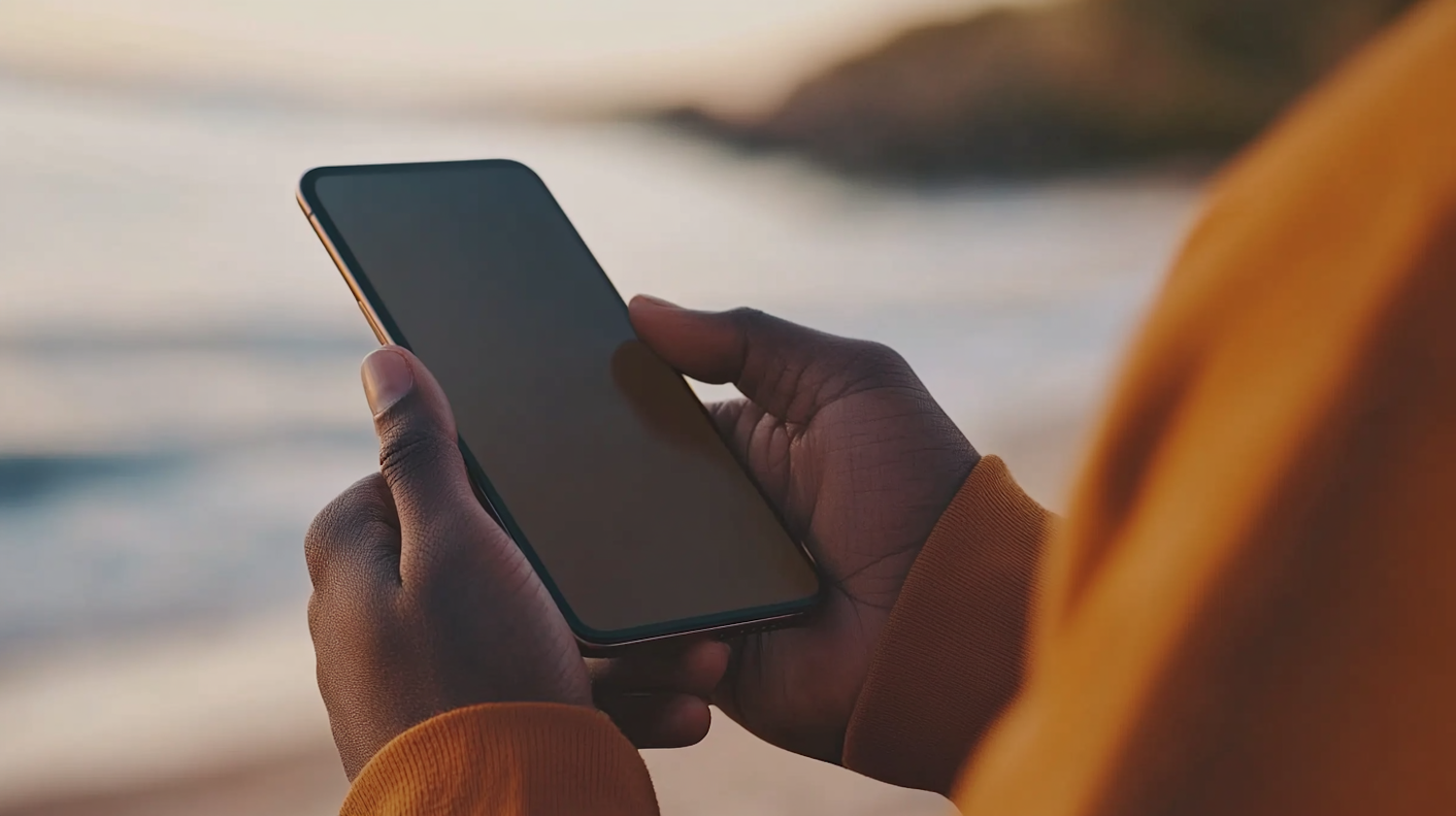 Person Holding Smartphone Outdoors