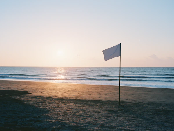 Serene Flagpole on Beach Sunrise