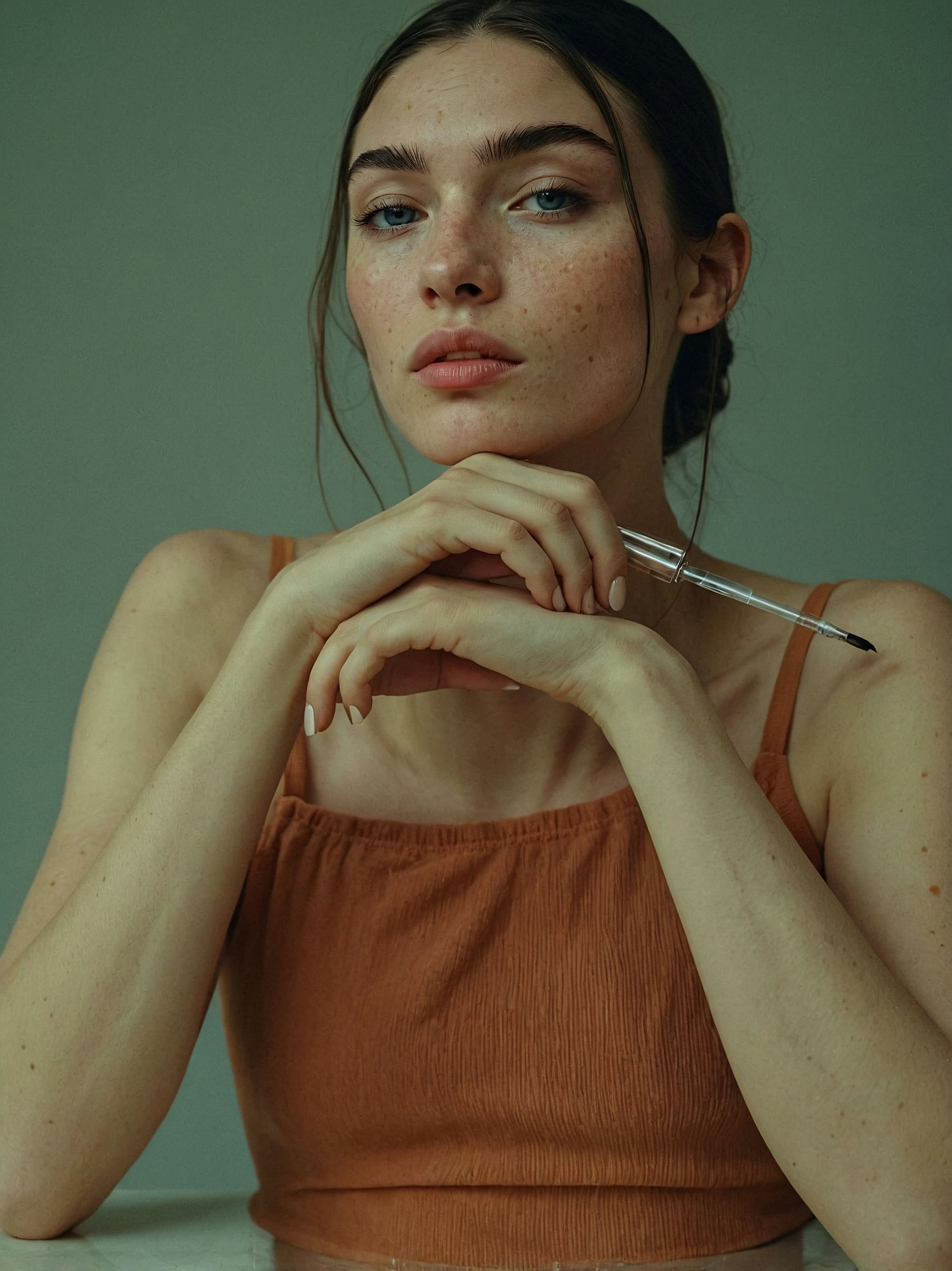 Contemplative Woman with Pen