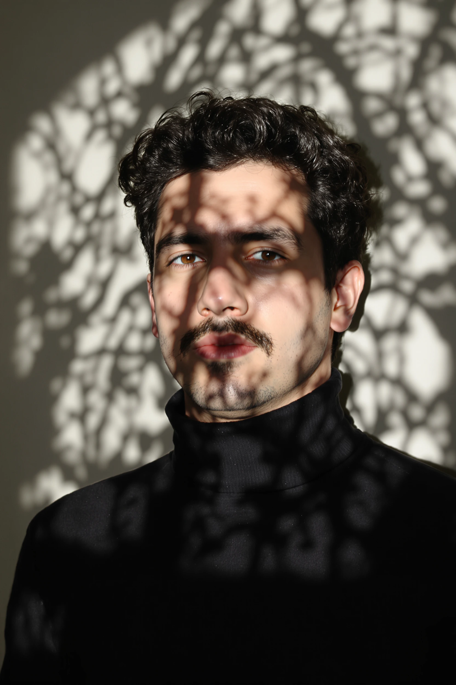 Man with Curly Hair in Dramatic Lighting