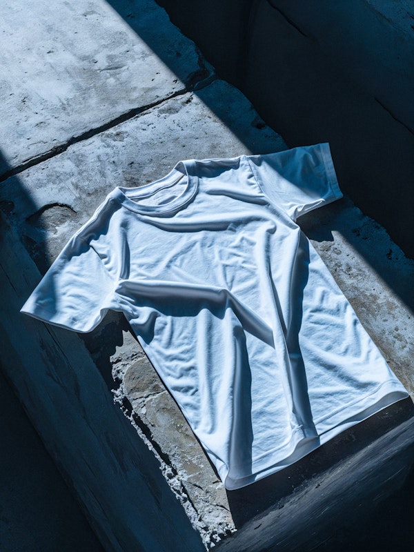 White T-Shirt Mockup on Textured Concrete