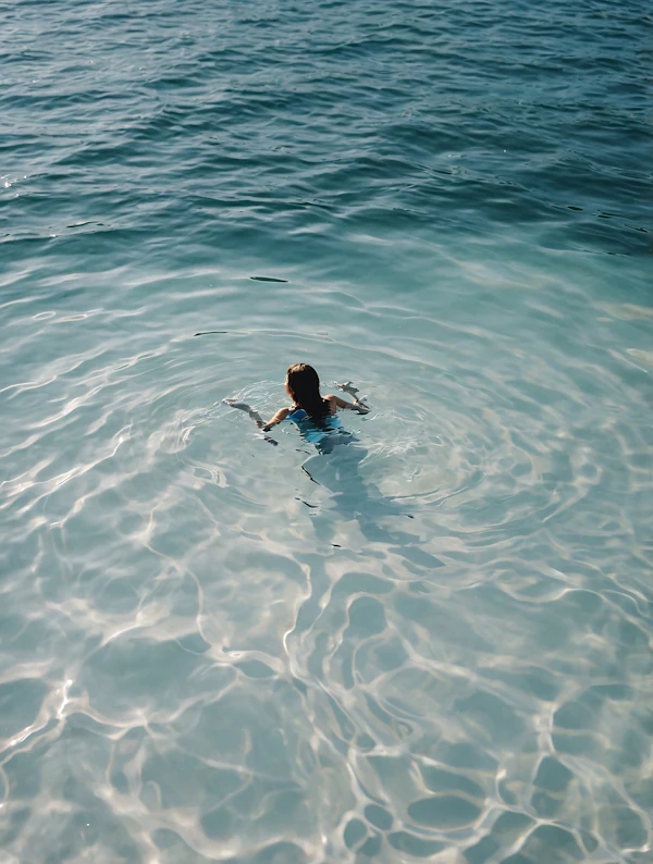 Swimmer in Turquoise Waters