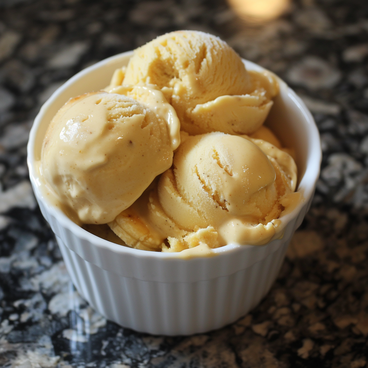 Bowl of Vanilla Ice Cream on Granite Countertop