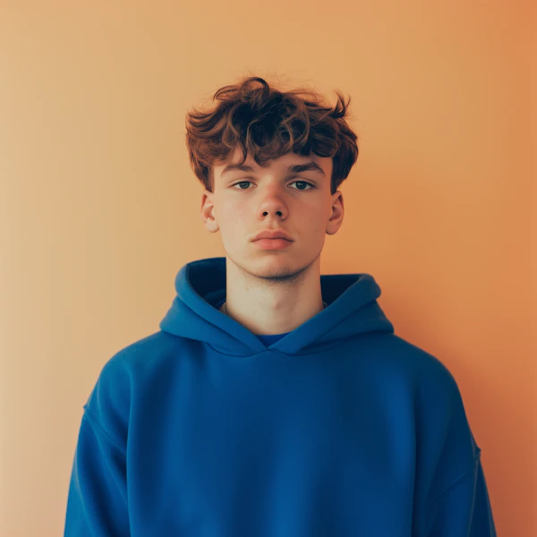 Portrait of a Young Person in Blue Hoodie