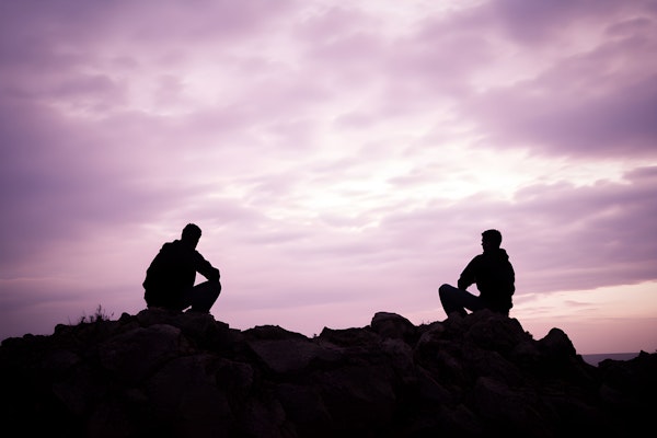 Silhouetted Figures at Dusk