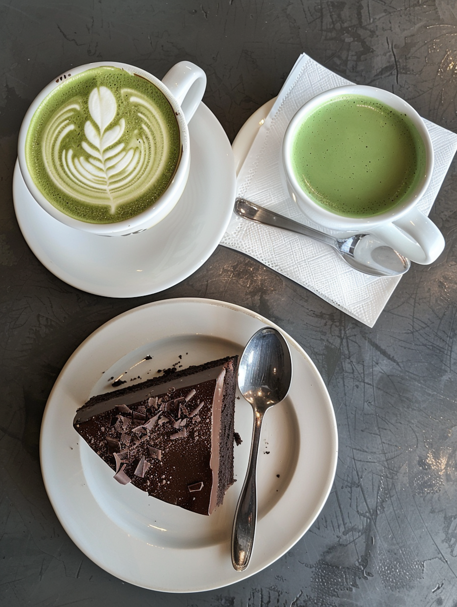 Cozy Cafe Display with Chocolate Cake and Matcha Beverages