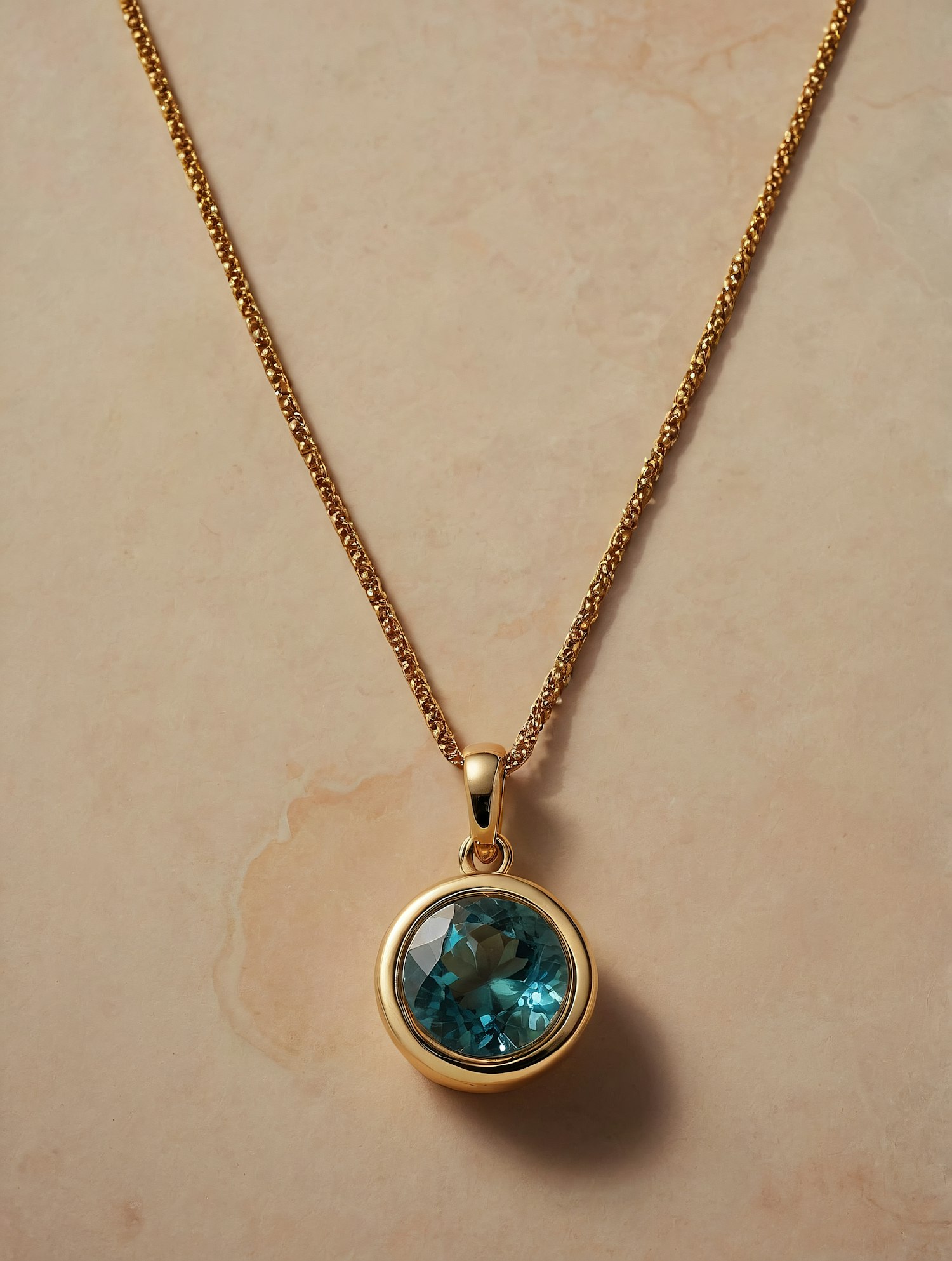 Gold Necklace with Blue Gemstone Pendant