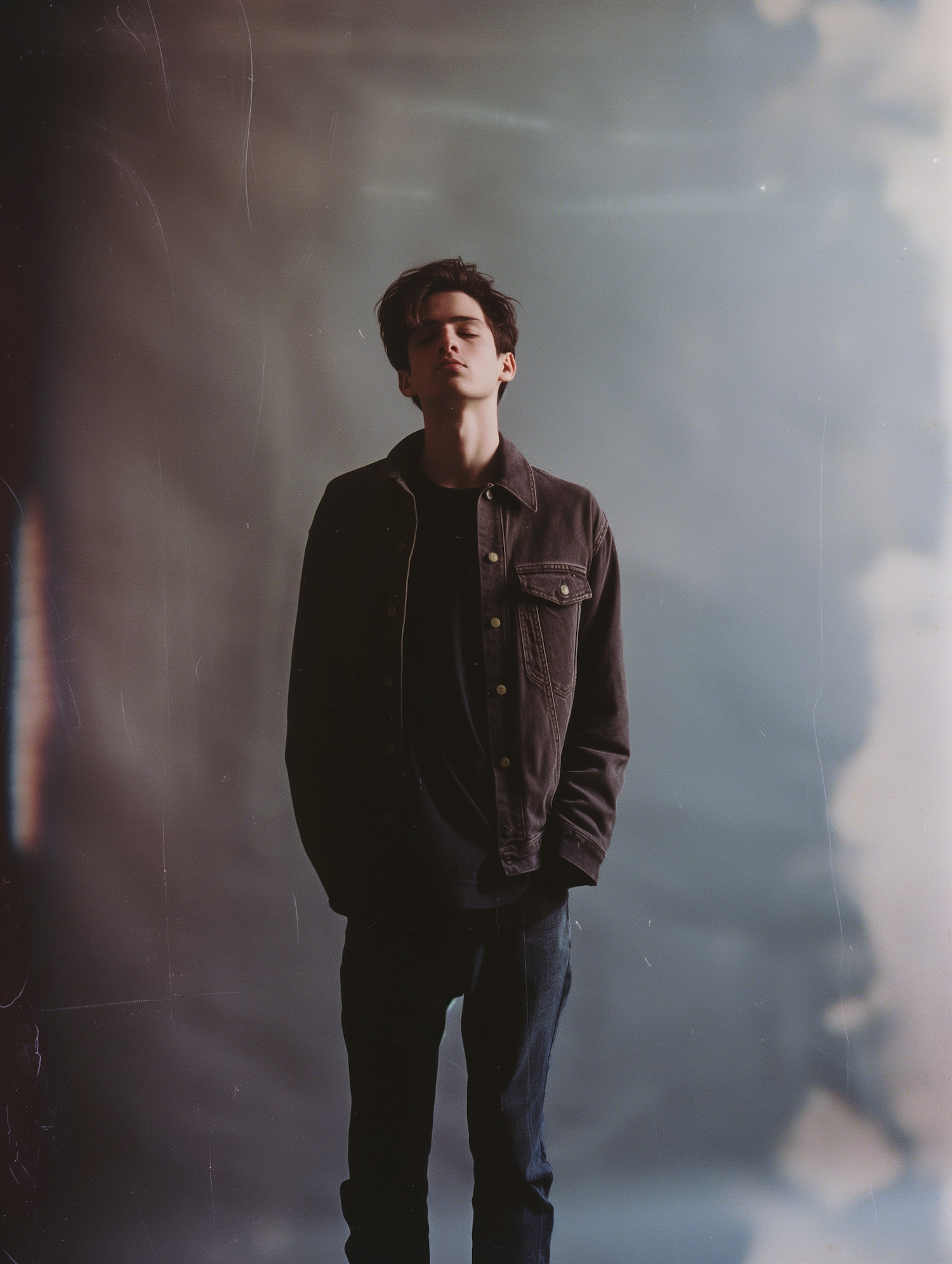 Contemplative Young Man in Denim