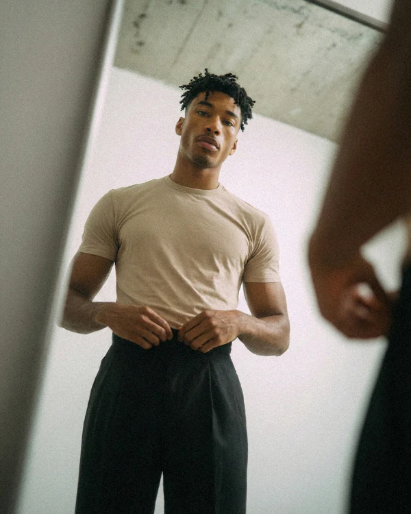 Man Adjusting Clothing