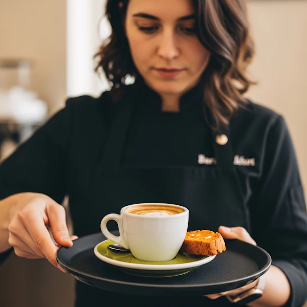 Barista Serving Coffee