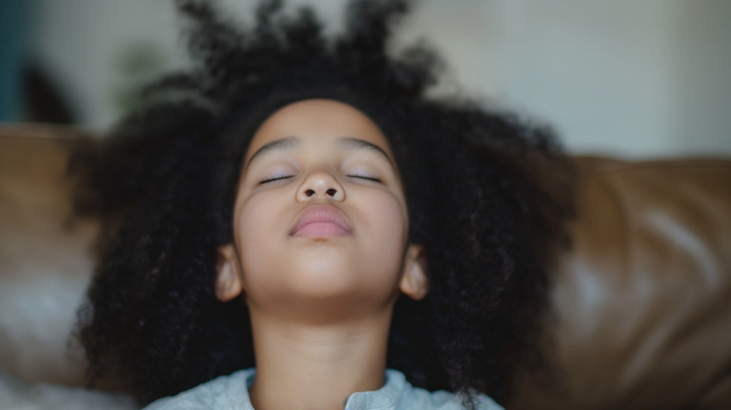 Tranquil Girl Relaxing on Couch