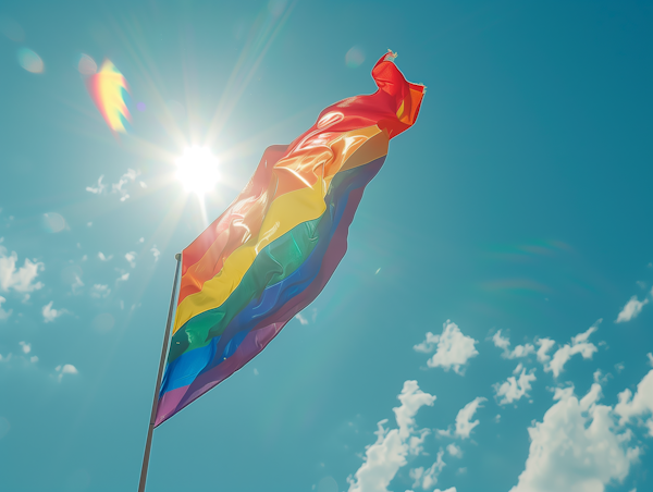 Rainbow Pride Flag Under Sunlit Sky