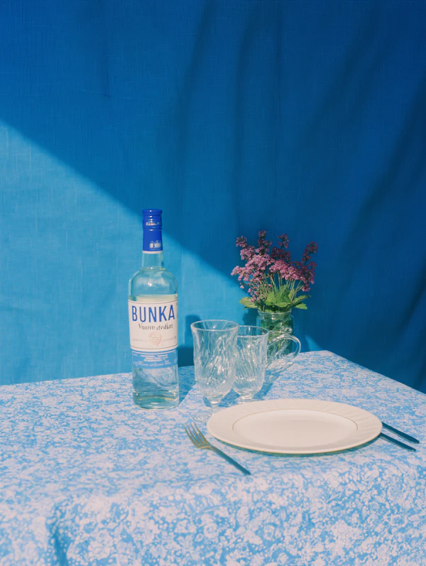 Elegant Table Setting with Vodka Bottle
