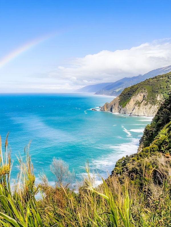 Serene Coastal Landscape with Rainbow