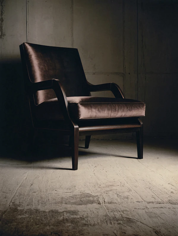 Elegant Armchair Against Textured Wall