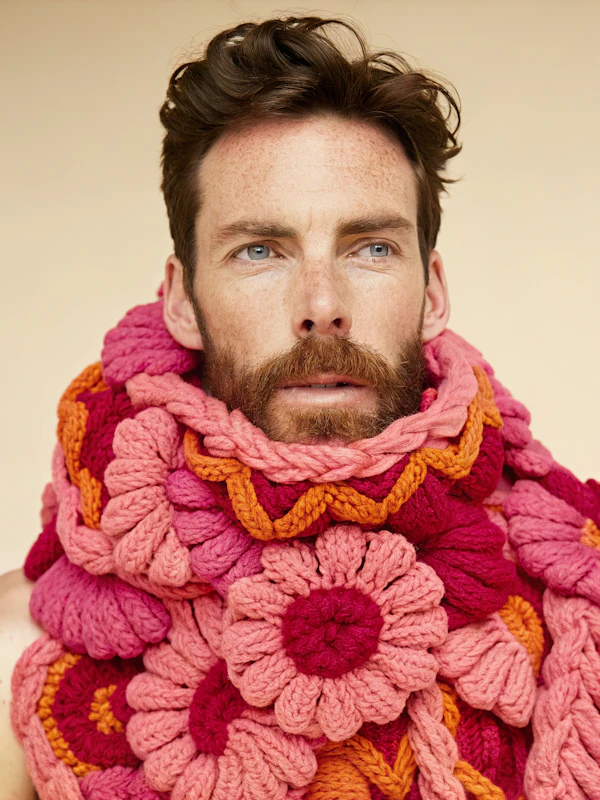 Man with Vibrant Knitted Scarf