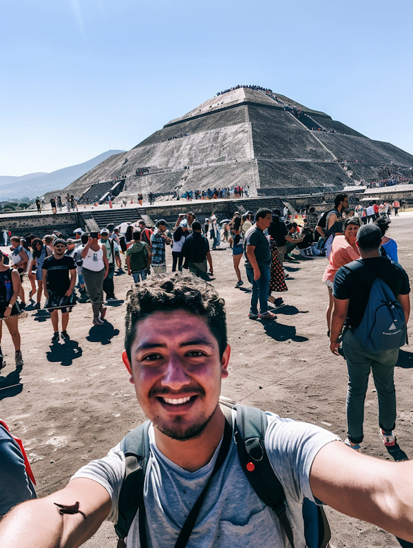 Smiling Man Taking Selfie at Ancient Pyramid