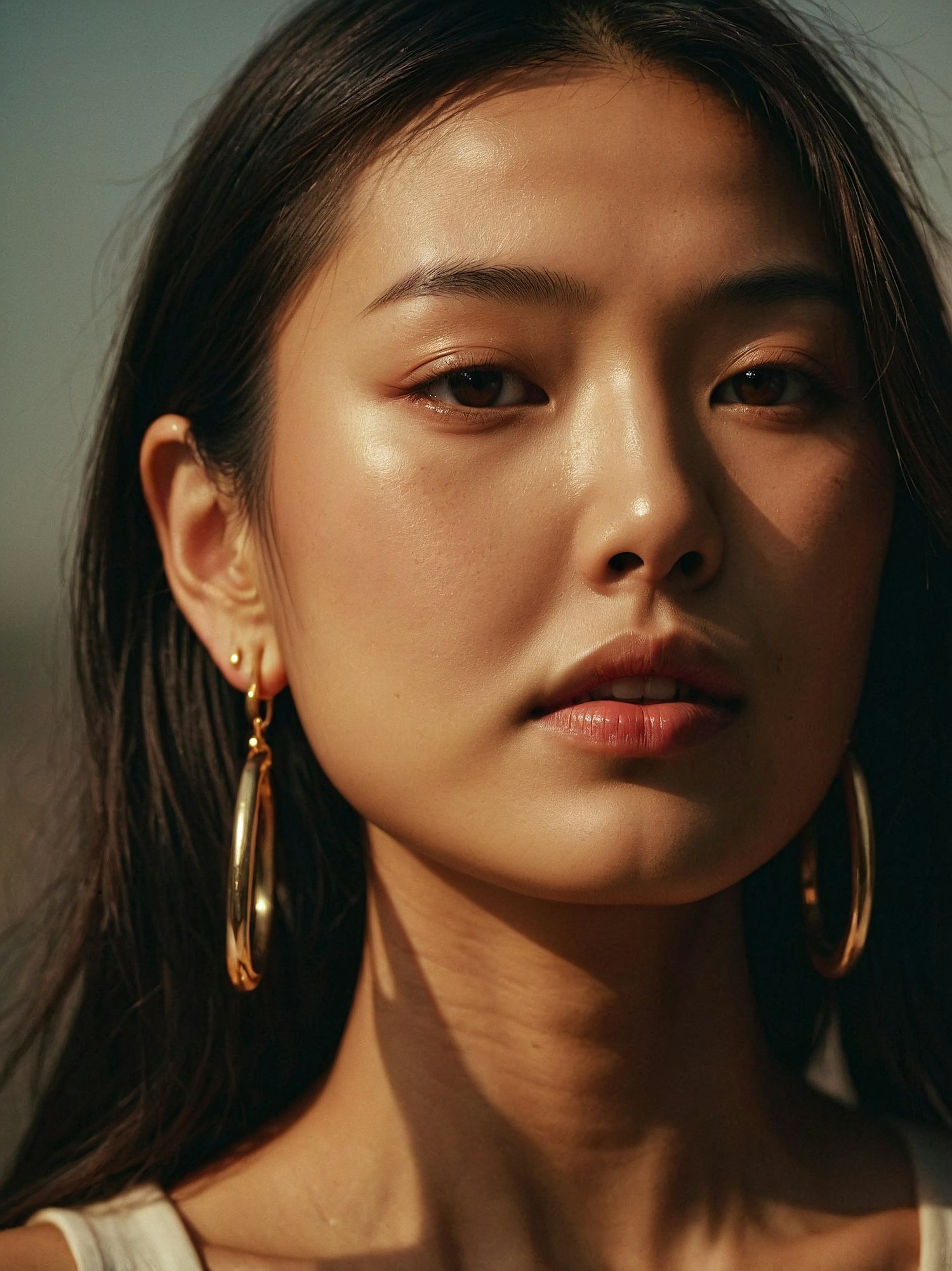 Elegant Woman with Gold Hoop Earrings