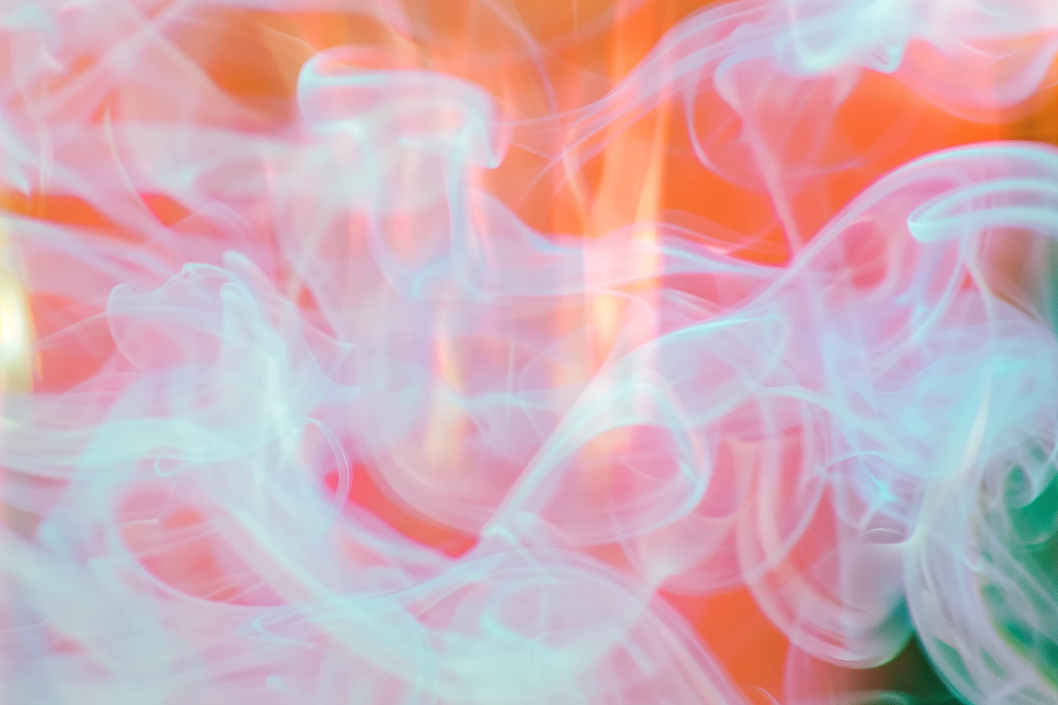 Pastel blue and pink smoke-like swirls over a warm orange-red gradient