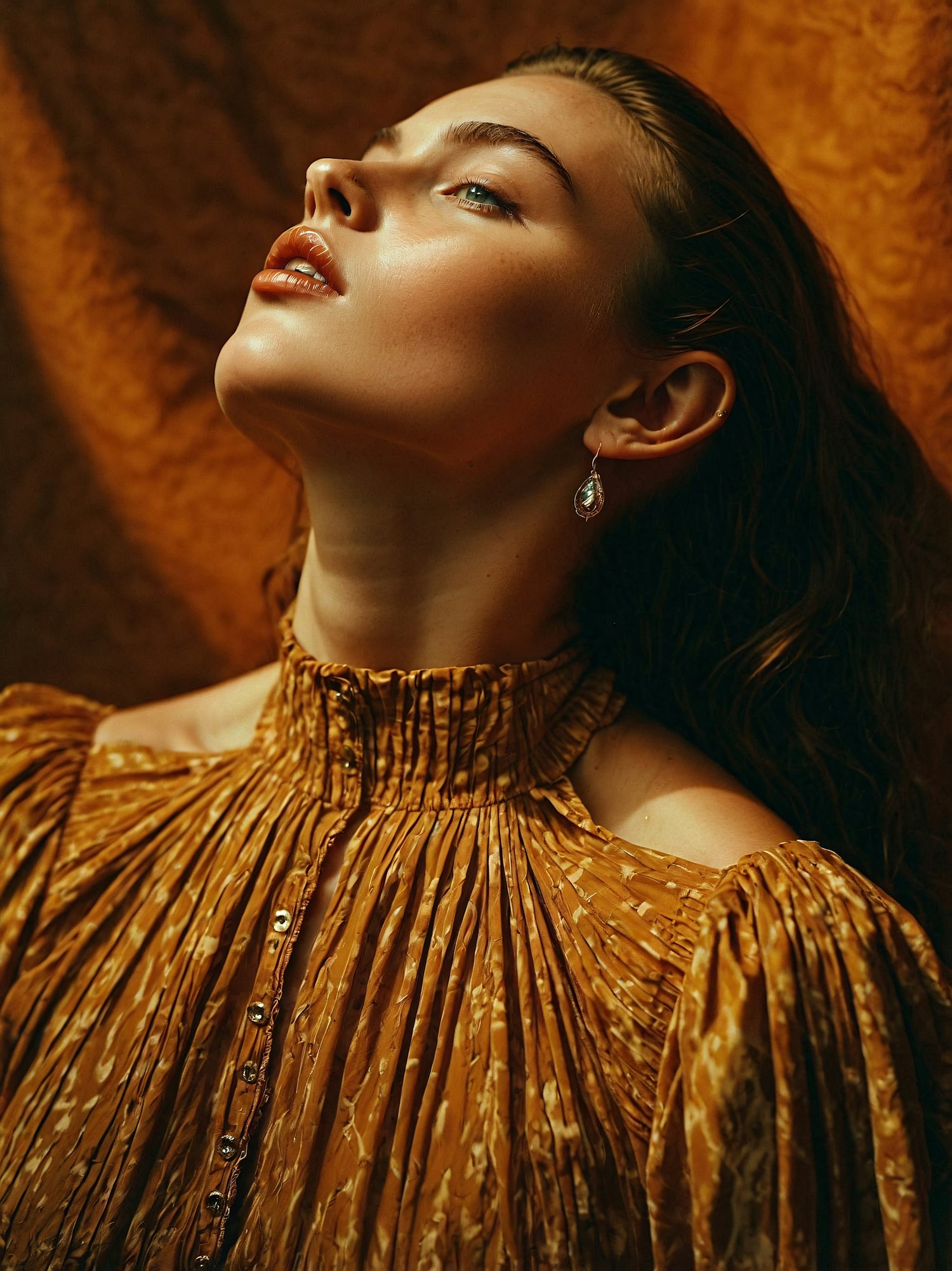 Elegant Woman in Golden-Brown Garment