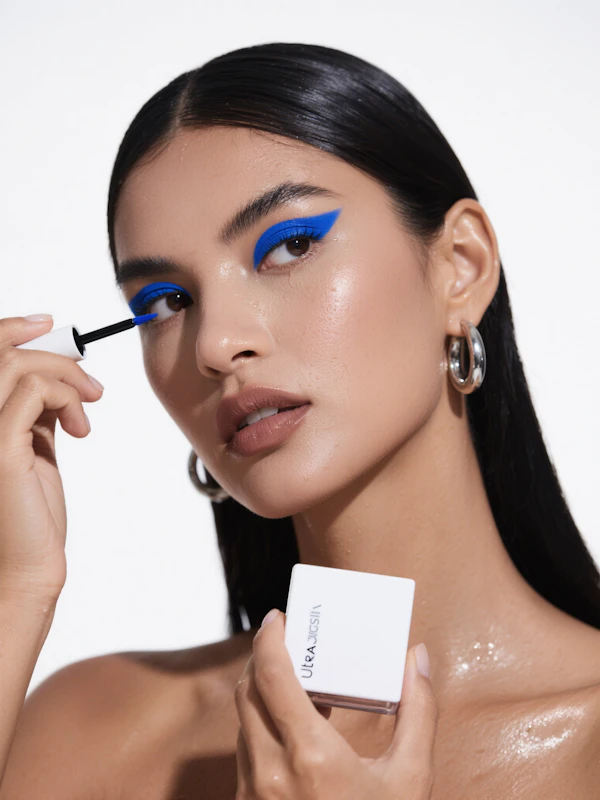 Woman Applying Eyeliner