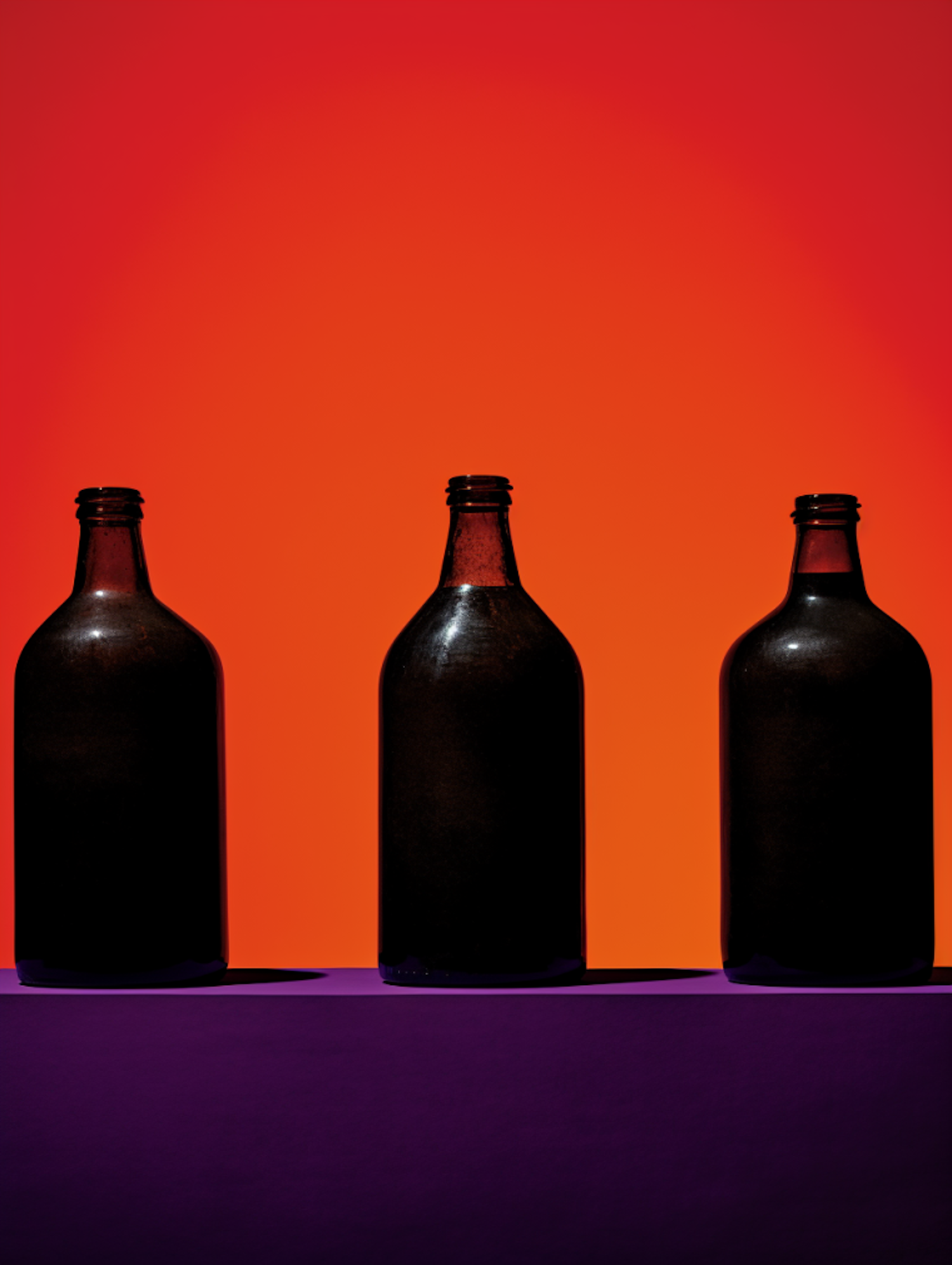 Triad of Silhouette Bottles on Orange and Purple