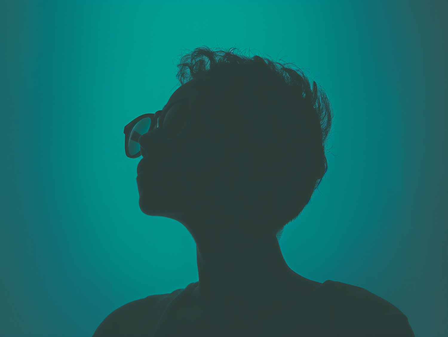 Contemplative Silhouette in Teal