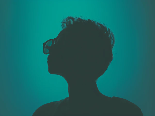 Contemplative Silhouette in Teal