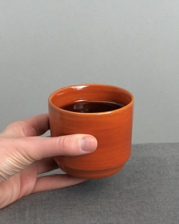 Hand Holding Ceramic Cup
