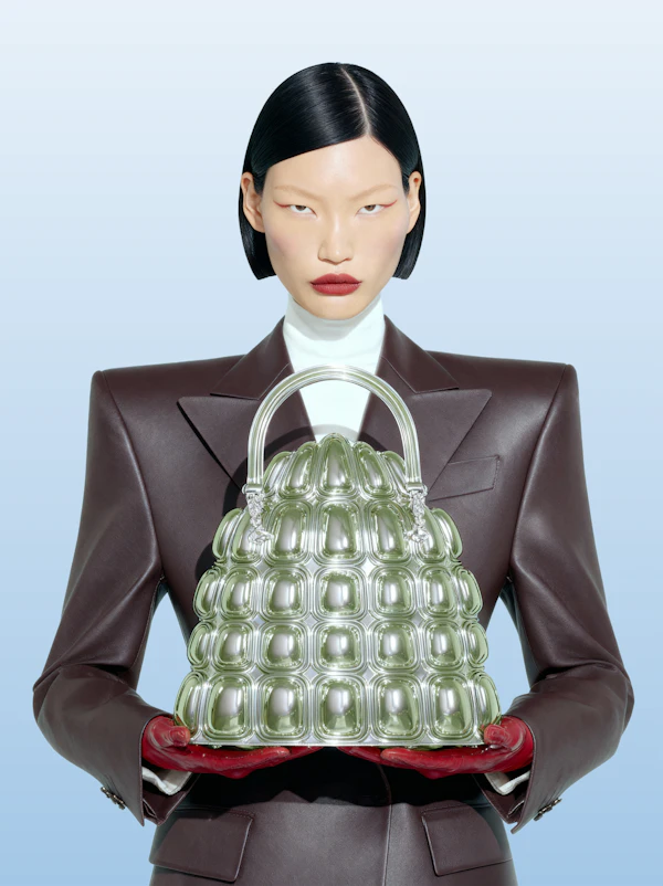 Elegant Portrait of Model Holding Green Handbag