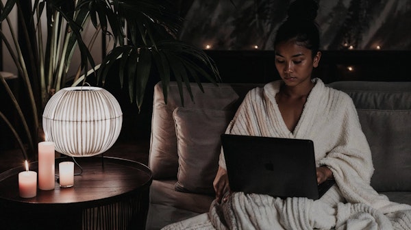 Cozy Indoor Scene with Woman on Laptop