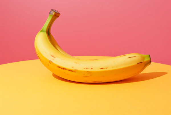 Vibrant Simplicity: Ripe Banana on Pink