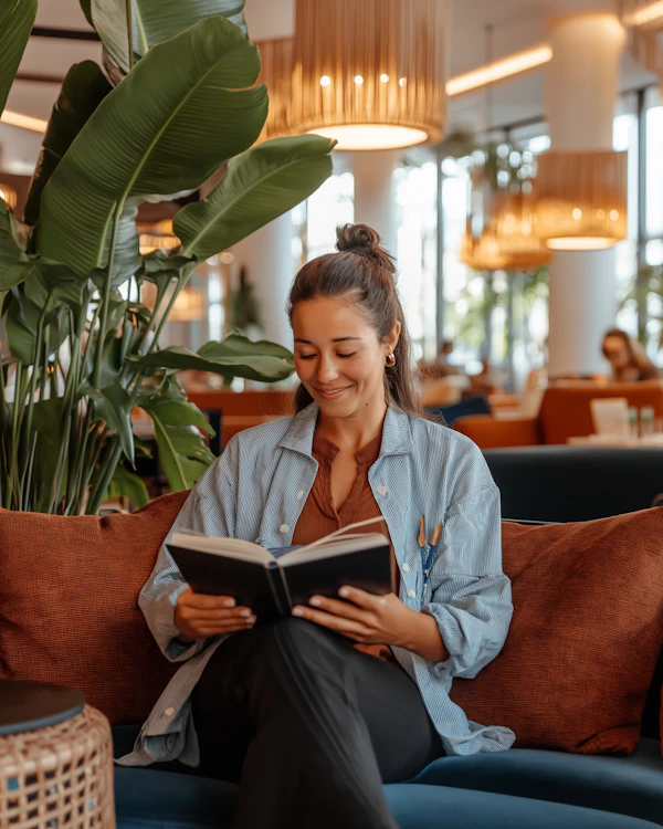 Woman Reading in Café