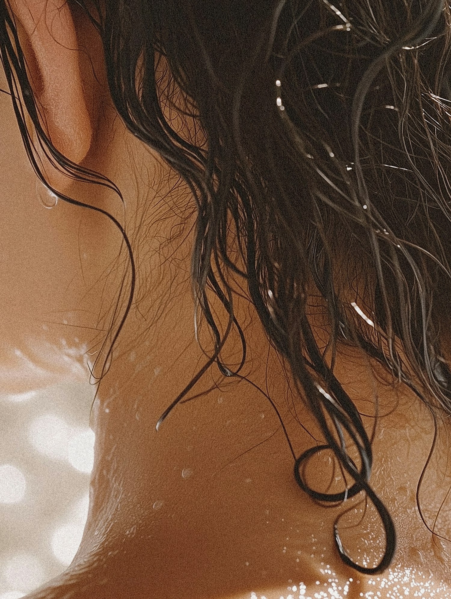 Close-up of Neck and Ear with Wet Hair