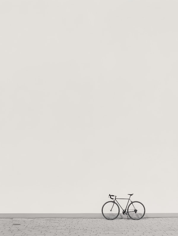 Solitary Bicycle Against White Wall