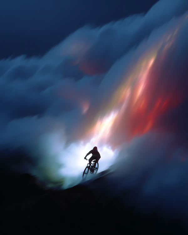 Cyclist in Vibrant Sky